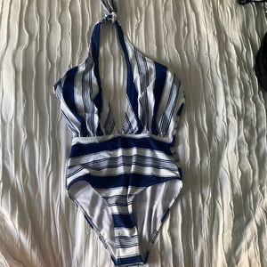 Blue swimsuit from CUPSHE, full suit, ties in the back and is backless.